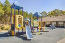 Cadence Academy Preschool Brier Creek Playground 2 Slides Jungle Gym and Other Activities Safely Enclosed In Back of Facility