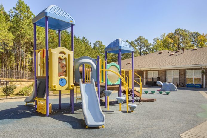Cadence Academy Preschool Brier Creek Playground 2 Slides Jungle Gym and Other Activities Safely Enclosed In Back of Facility