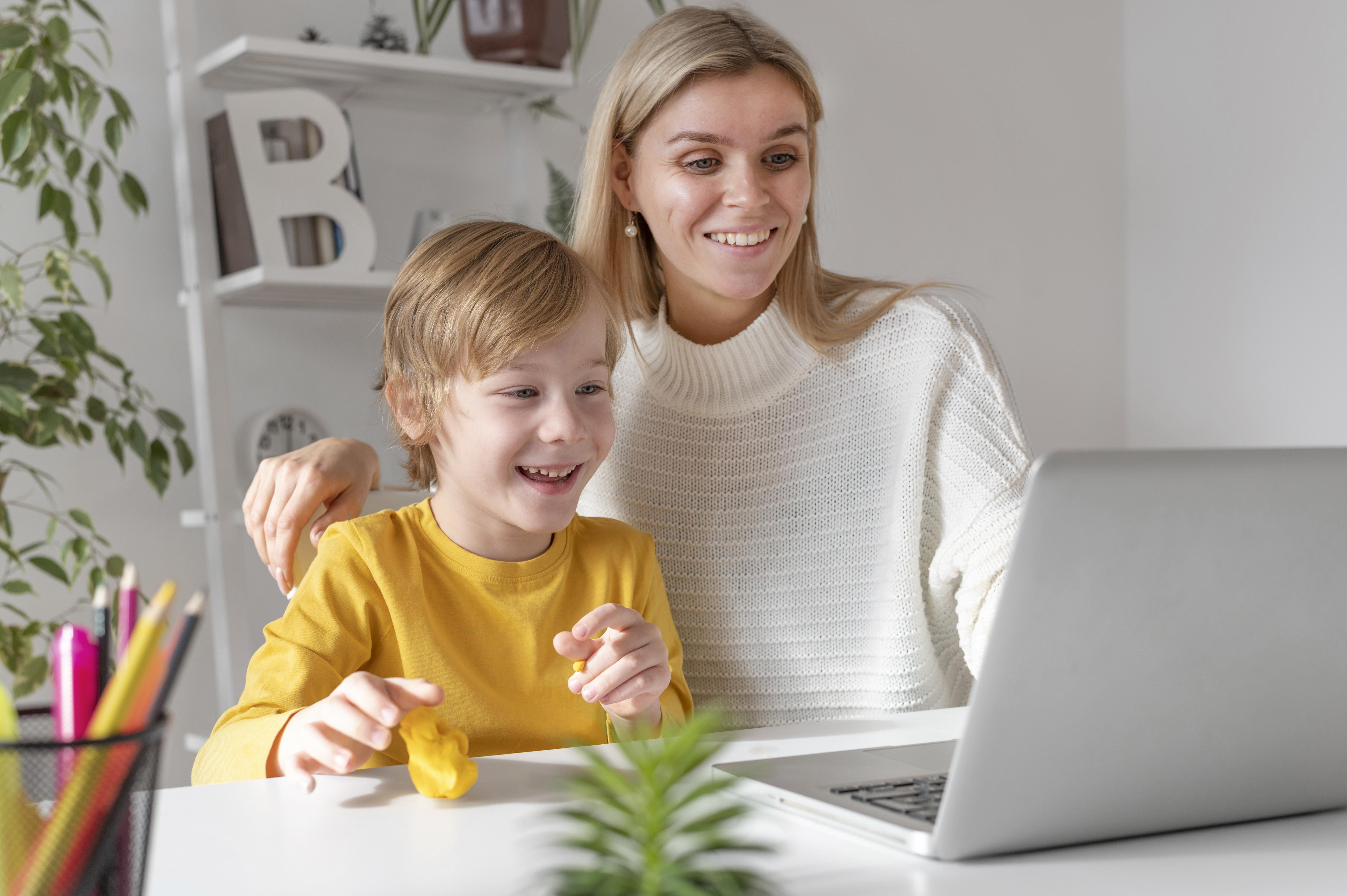mom and son on computer fifty activities for kids free learning tools and resources